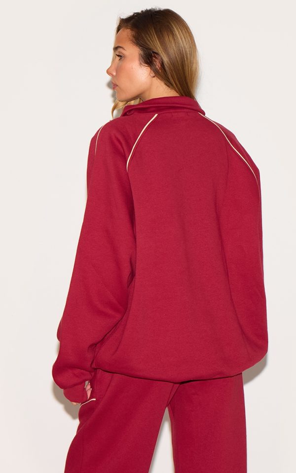 03fbe2d9fb70fa0348cce848129900565af5a0f4_CNM4812_2_red_oversized_contrast_piping_quarter_zip_sweatshirt