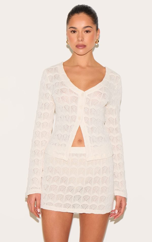 064641a4cffefb63f5a6d27261fcf0ed2823dd3b_CNM7412_1_almond_textured_button_up_flared_sleeve_cardigan