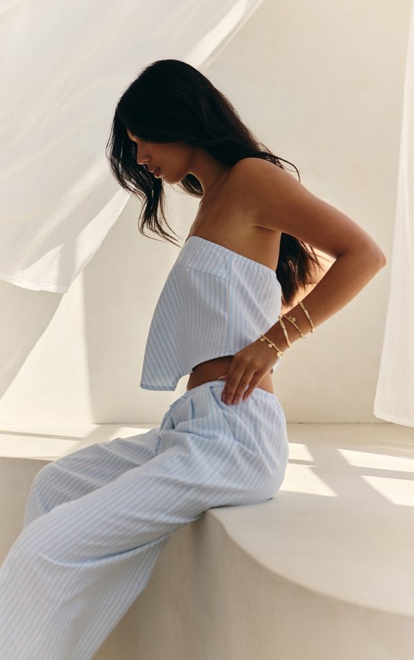06d29e64c856b71ef821aebcdc80b6d95205c9b3_CNM8813_1_blue_pinstriped_bandeau_dipped_hem_top