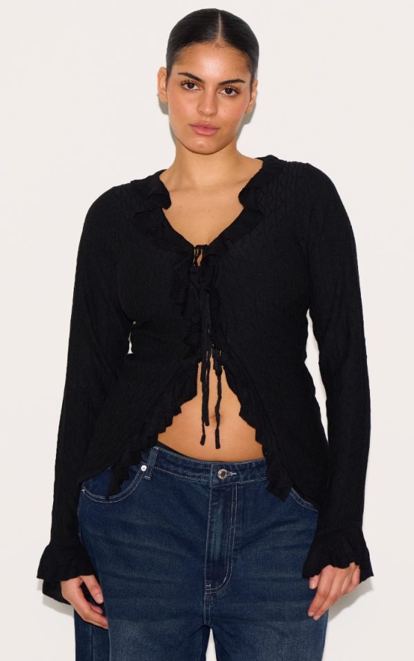 11cf6905b654669f55d2718bbe1303a515b62981_CNH3152_1_plus_black_textured_knit_frill_detail_tie_front_top