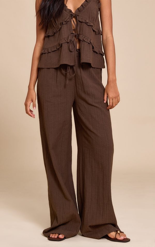 1464ea12ac02274bf3306a79acc2c8348959c19e_CNM3209_1_brown_textured_mid_rise_wide_leg_trousers