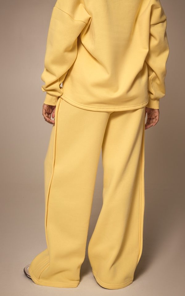 1fbf8325fe4f7fbfffc660494f28b2b54aa4573a_CNM6508_3_butter_yellow_wide_leg_pleated_detail_joggers