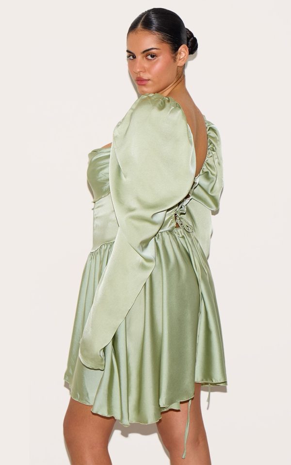 216fef9d60e4db74400fb2b5a8cc57ccd8a0021d_CNH8567_2_plus_sage_green_satin_corset_detail_puffball_shift_dress