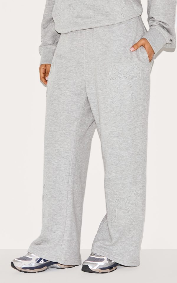 23fec43aad8ab82ce3c8db88fdf1e79c54b3fdc4_CNK8297_2_petite_grey_marl_embossed_bow_detail_wide_leg_joggers