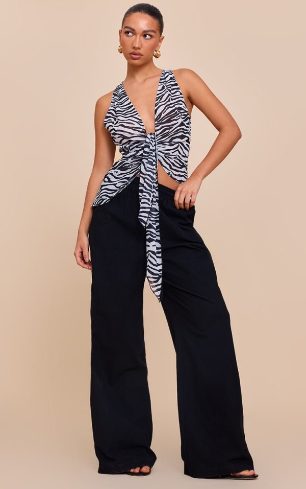 27d39f79e45c0da573018f980e8600a0e683ddfe_CNN1297_3_monochrome_zebra_printed_drape_plunge_front_chiffon_long_top