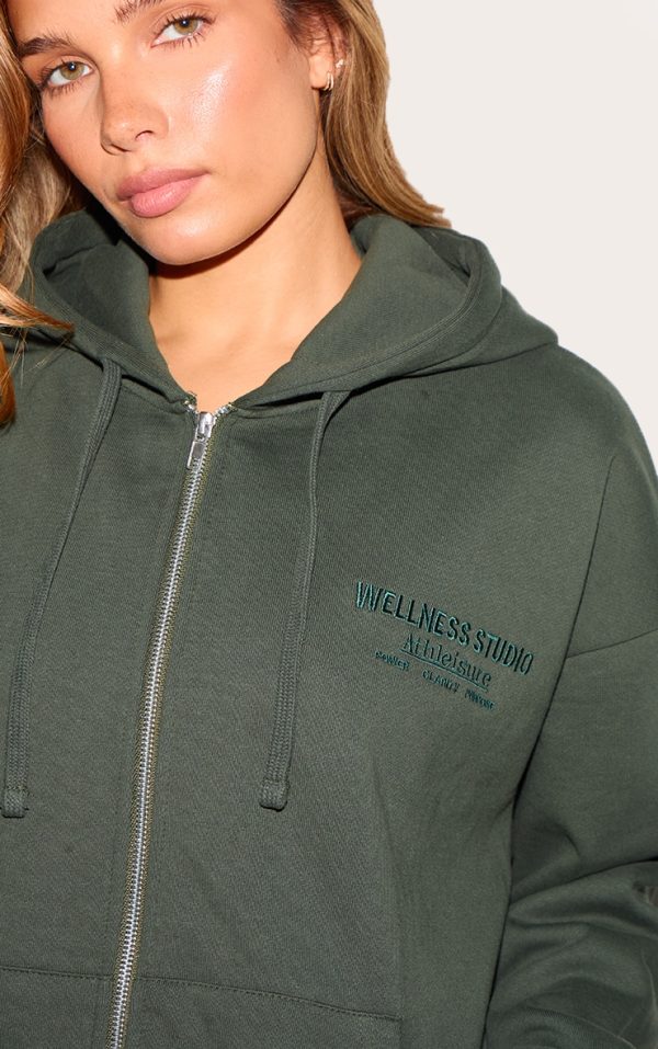 29dbcd05cbc213abf97693a65a51a444af37bf17_CNL8265_4_forest_green_wellness_premium_embroidered_zip_front_oversized_hoodie
