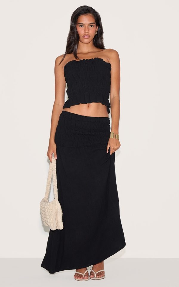 37bd53b8eaa8f4bee191277909add71653f9f562_CNM9995_1_black_textured_shirred_panel_mid_rise_maxi_skirt