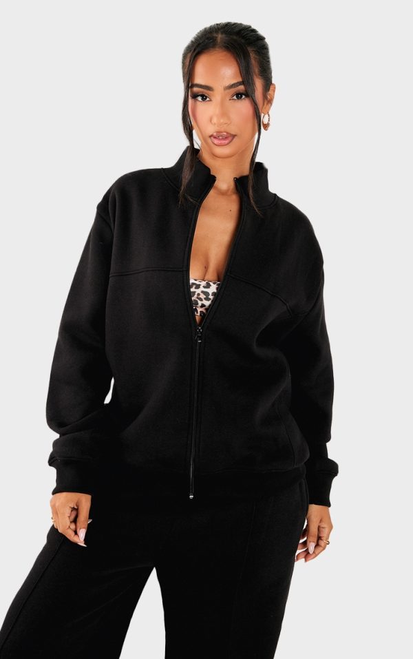 3e238667c4298a4291a09d3cb4e0fe940033ee7d_CNK4386_1_petite_black_seam_detail_zip_through_track_top