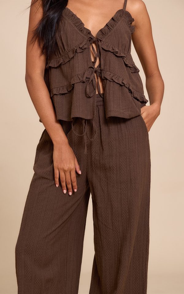42534199e61da05b8d52d42e66dce17b00896e54_CNM3209_4_brown_textured_mid_rise_wide_leg_trousers