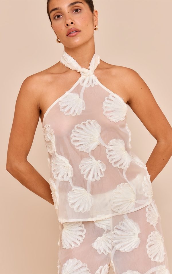 50f8f2a34ed931cb8b7ab813286bf7663e850822_CNM7075_4_petite_cream_sheer_shell_applique_knot_detail_top