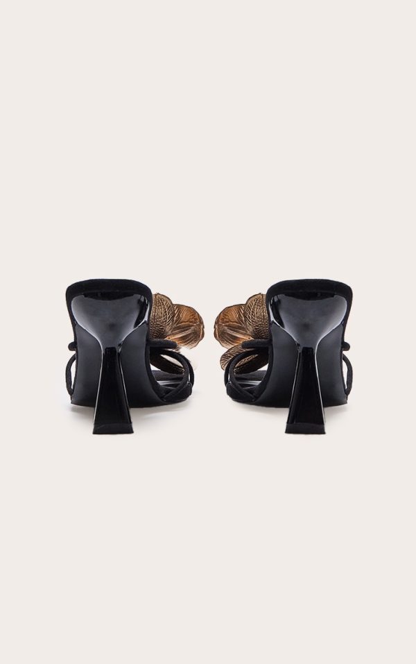 5d0281cf1bc4bd23e41f7aaf7449fb160d126122_CNK3612_3_black_faux_suede_square_toe_gold_flower_detailed_heeled_mules