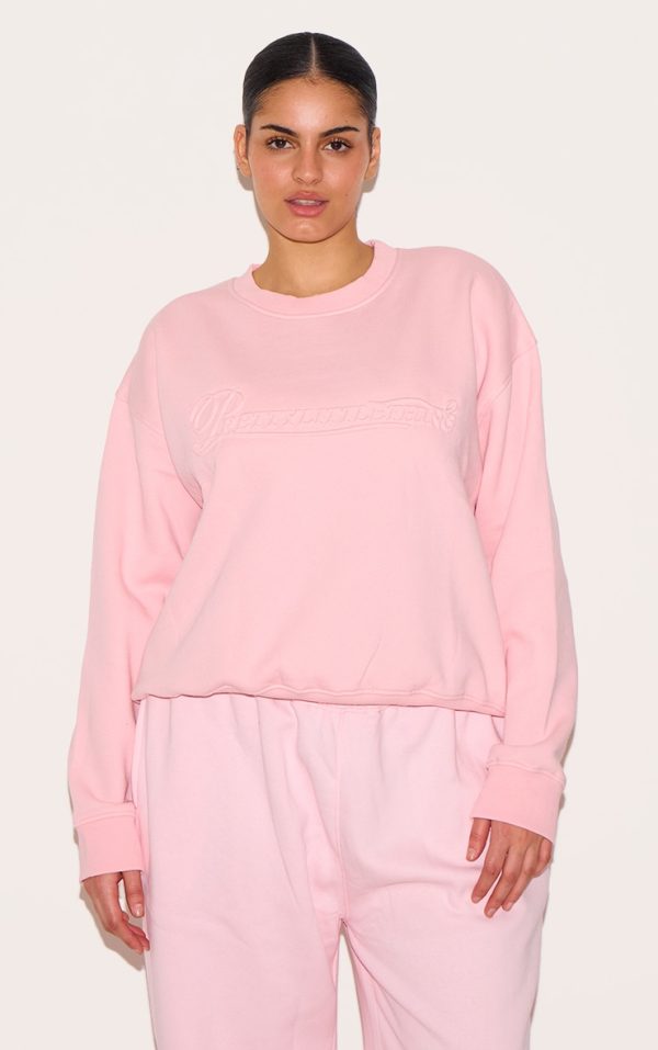5d5a1faf12aaf25b43dc126383d98991671d7fce_CNK3401_1_plus_baby_pink_embossed_graphic_oversized_sweatshirt