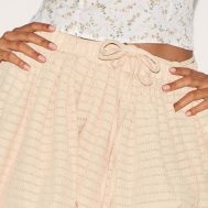 67d0d3e4a0cfa0553af7aec0be89e658317238b8_CNM0508_5_butter_yellow_textured_tie_waist_detail_puffball_mini_skirt