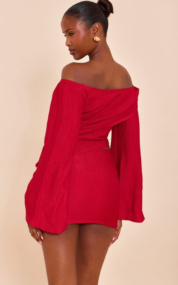 7b2e0f6424a7d45981c5a047df052ddba67d4196_CNM8799_2_tomato_red_textured_gold_detail_bardot_long_sleeve_top