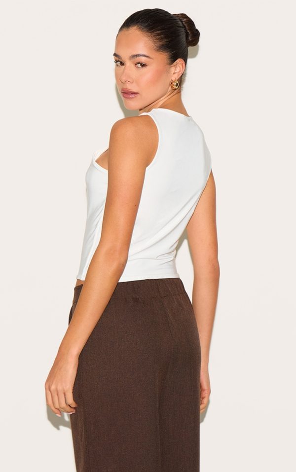 898c11fd448b4859bf571fc1918cbd5f6ff6dbee_CNM8018_2_cream_double_layer_slinky_trim_detail_long_vest_top