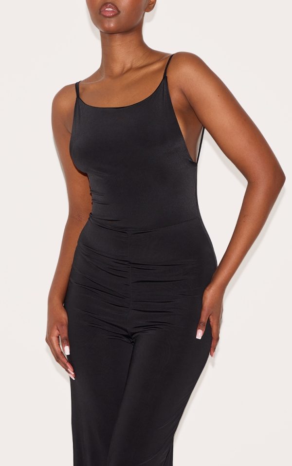 8b8a27e712cdee51fc2e4ba7aa04a2ef5f24da9f_CNM3115_4_black_double_layer_slinky_low_back_strappy_wide_leg_jumpsuit-1
