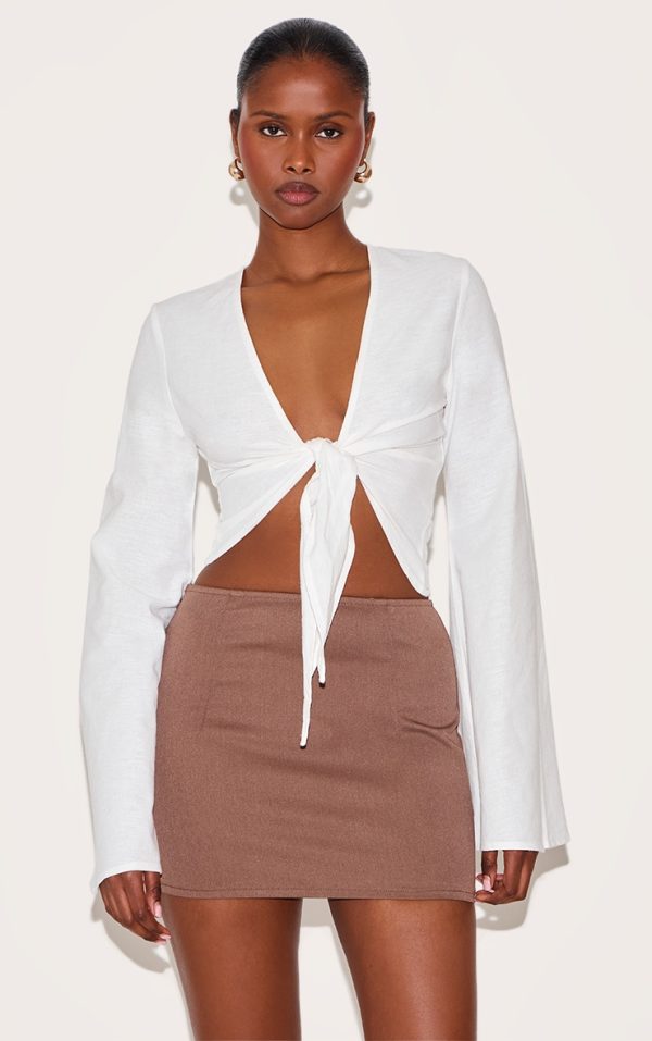 934f95268933d41d283e44293a55d425fc27256a_CNM4653_1_white_lightweight_woven_knot_front_drape_detail_blouse