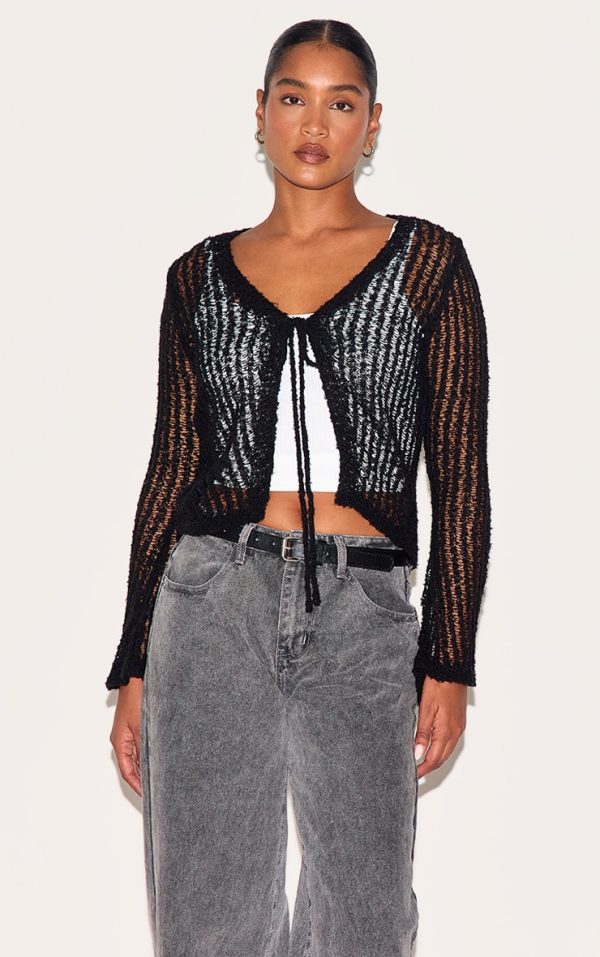 97ee4341e1aad89d02fb4ecbd6a3cf74546613ff_CNL3274_1_black_ladder_knit_sheer_cropped_tie_front_top
