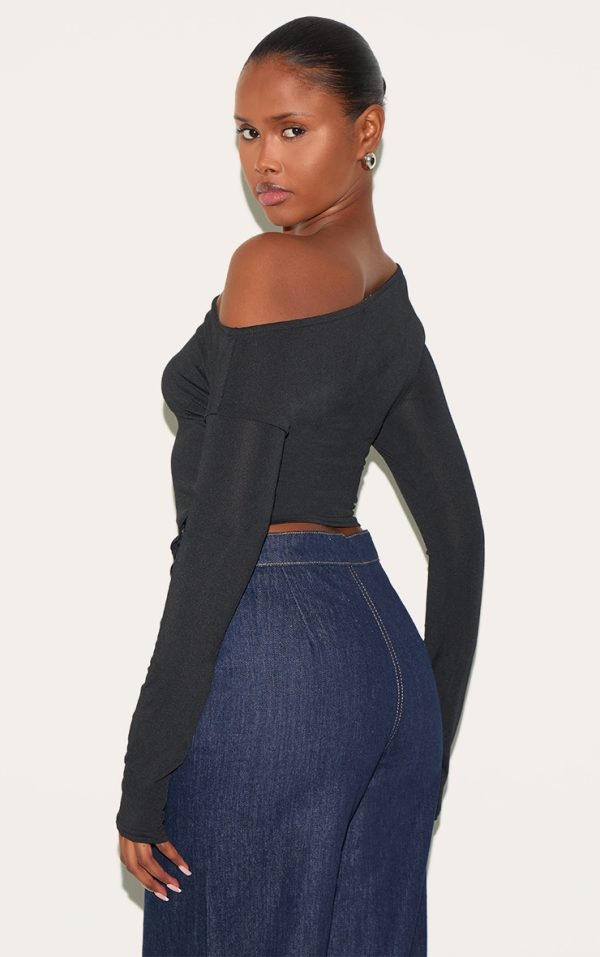 9e0ae3cd7a4e370dd0ef50db8edeff9a7fb8035b_CNL4698_2_black_slinky_asymmetric_neck_popper_detail_long_sleeve_top