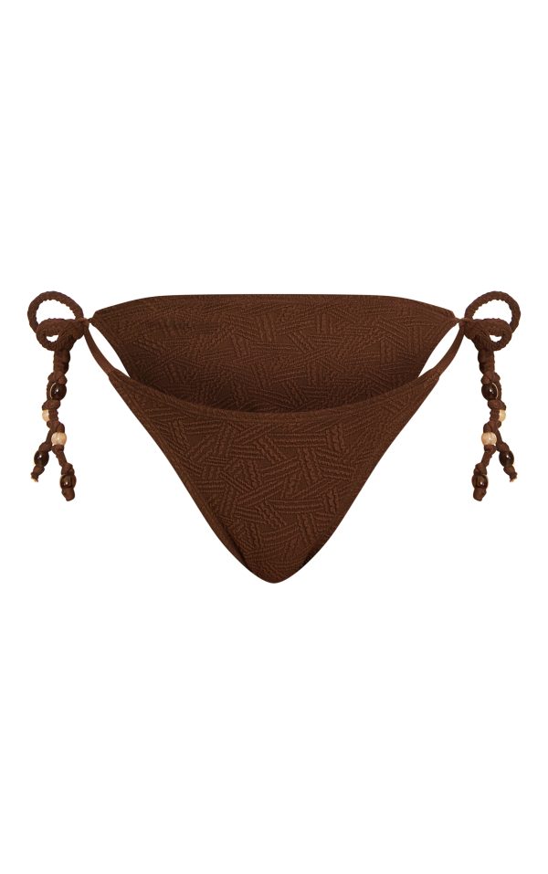 9fb8bba9b07db77e3c15a0ab1707a7ff87b39dd8_CNM6708_5_chocolate_textured_bead_trim_tie_side_bikini_bottoms