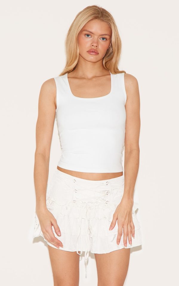 a40de0c632609c56c01e9a92339b352eba0c1ef8_CNL9198_4_ivory_lace_up_front_frilly_mini_skirt