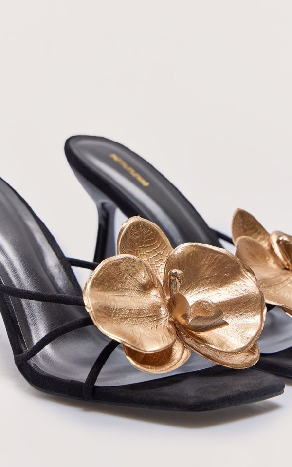 abfe1c34a63b7f856fa5d3845ce07e847cd57261_CNK3612_4_black_faux_suede_square_toe_gold_flower_detailed_heeled_mules