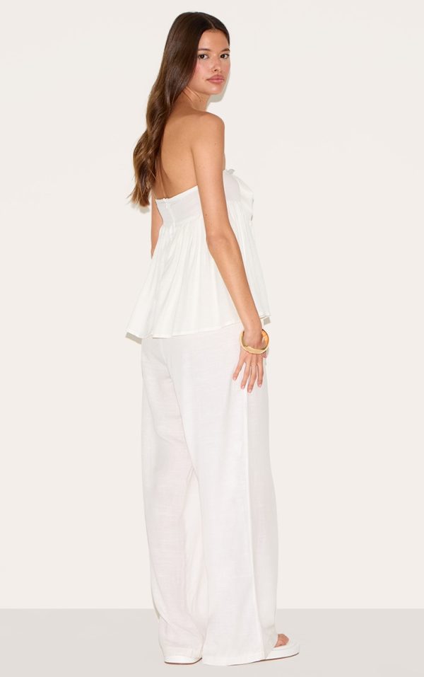 b0f219acc66ce8076539c369e174cdfc2accf1c2_CNM3884_2_white_bandeau_peplum_detail_jumpsuit