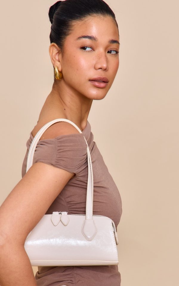 b186425c457616ba13049580f021be565962fa69_CNN2201_1_white_textured_faux_leather_bowler_bag