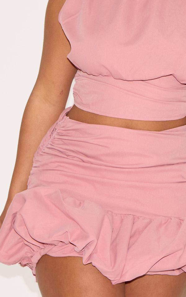 b1f047edfa1866c1eb3f44b23c331e8ca347e7f6_CNM6474_5_shape_rose_ruched_dropped_hem_puffball_mini_skirt