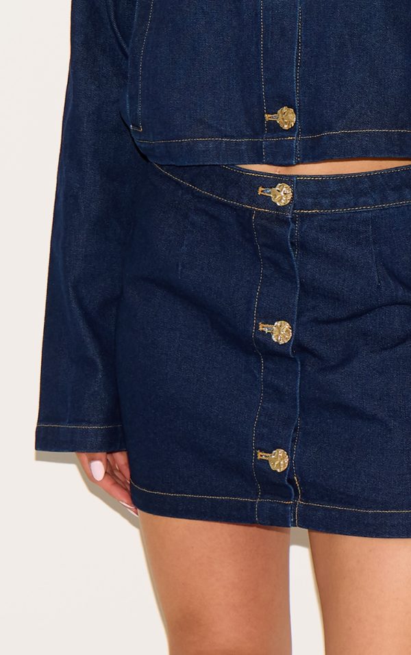 b570a47d344e483e66d2b5789f9bae6e764aa3ab_CNM4540_5_tall_dark_indigo_button_trim_denim_mini_skirt