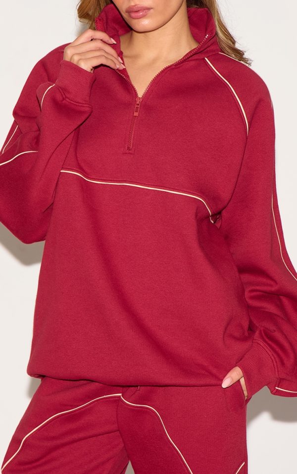ba0254b9740a3675772ee110bedaa42431af9b89_CNM4812_4_red_oversized_contrast_piping_quarter_zip_sweatshirt
