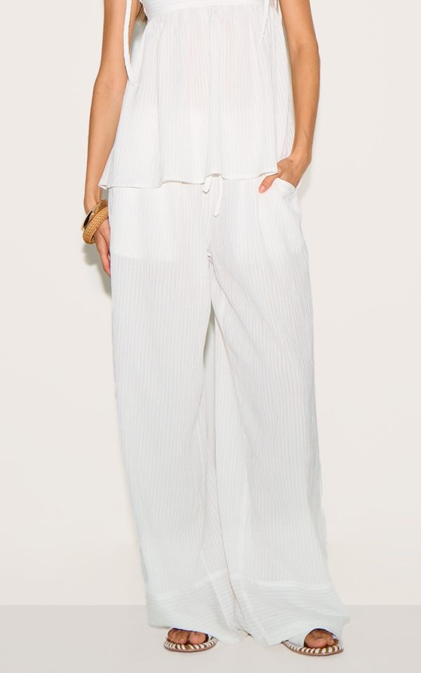 c1f29d6f6978572a3f8ac688d12e8e3648d82b14_CNM1912_1_white_woven_textured_straight_leg_trousers