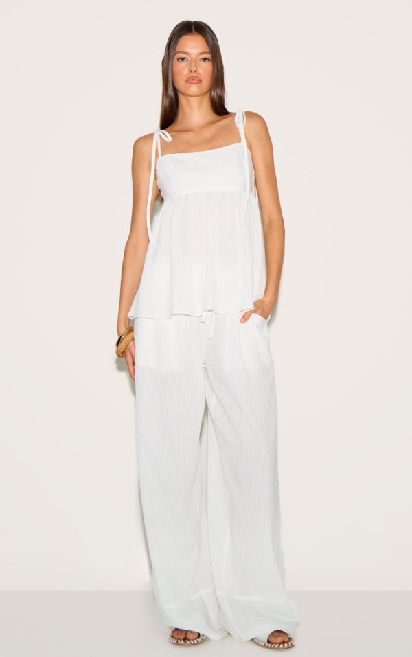 ccd4885040562aeee49208ce0285b30a4fe01c9f_CNM1912_2_white_woven_textured_straight_leg_trousers