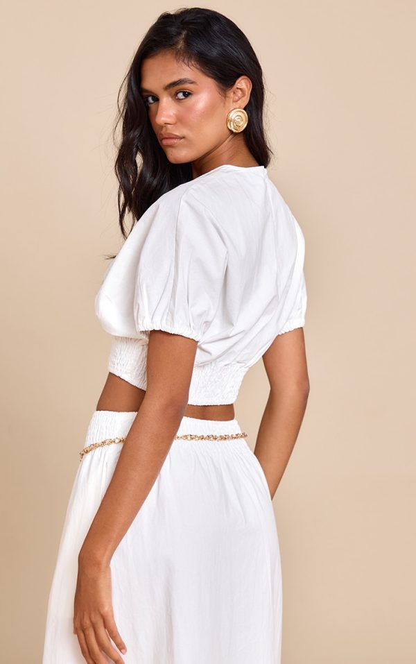 d2be32ae8b174f236b8b1c7af758f775309c7587_CNM1728_2_white_shirred_waist_cap_sleeve_crop_top