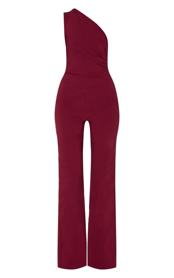d3444c6c9321b2b68e8f006b52b8369bf383cec9_CNM3112_5_wine_stretch_woven_one_shoulder_ruched_flared_jumpsuit