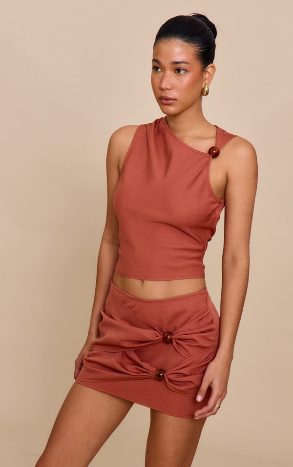 da3b8de034142fb4b16c3fedceda4d39631db0ae_CNM6158_4_rust_bead_detail_mini_skirt