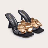 dd1a38007451f96902748691cd5a279078ceeacd_CNK3612_2_black_faux_suede_square_toe_gold_flower_detailed_heeled_mules