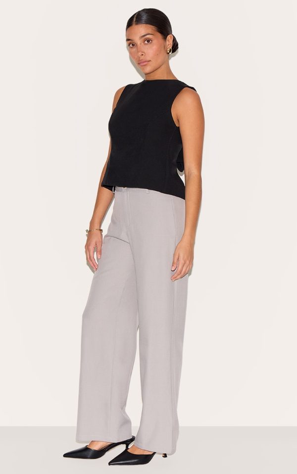 e43bc15eb850abae28330e1ee7e6f8413ead0918_CNM9015_3_petite_black_sleeveless_bow_detail_top